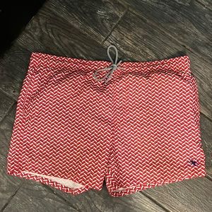 The World’s Your Lobster Swim Trunks